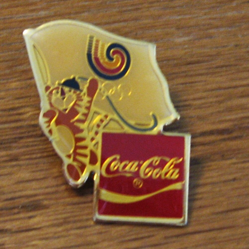 Coca - cola lapel pin for the Olypmics